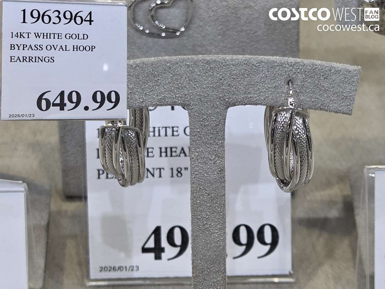 1963964 14KT WHITE GOLD BYPASS OVAL HOOP EARRINGS $649.99